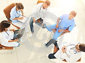 Medical staff ,discussing the work plan with the patients