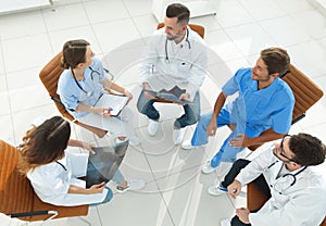 Medical staff ,discussing the work plan with the patients