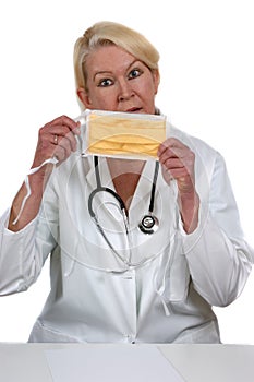 Medical staff member holds a clinical mask