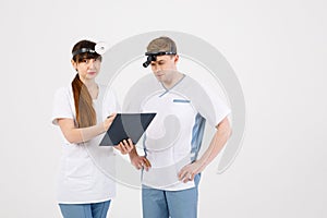 Medical staff. Portrait of two otolaryngologists working on an isolated white background that solves various issues