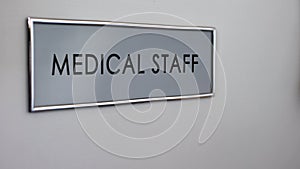 Medical staff room door desk closeup, first medical aid, healthcare reform