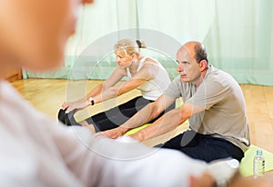 Medical staff with senior people at gym