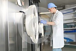 Medical staff sterilizing check the machine
