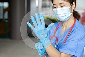 Medical staff wearing gloves to prepare for the outbreak of communicable diseases Corona Virus COVID-19