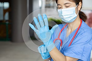 Medical staff wearing gloves to prepare for the outbreak of communicable diseases Corona Virus COVID-19 photo