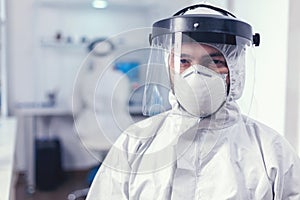 Medical staff wearing protective equipment in laboratory for covid research photo