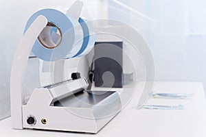 Medical sterilization packaging machine and roll pack for sterilized dental instruments.