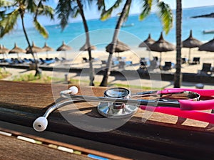 Medical stethoscope on background of ocean sea in tropics