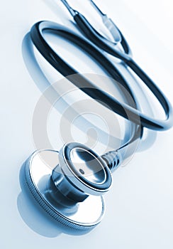 Medical stethoscope on blue