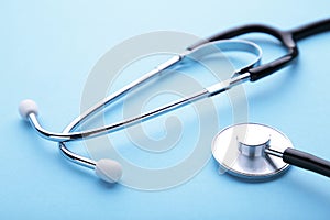 Medical stethoscope on a blue background. Health care concept