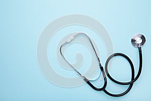 Medical stethoscope on a blue background. Health care concept