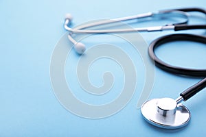 Medical stethoscope on a blue background. Health care concept