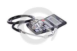 Medical stethoscope and calculator on white