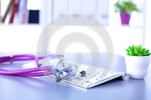 Medical stethoscope with a computer on the desk
