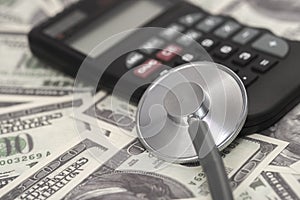 Medical stethoscope on dollars banknote.