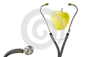 Medical stethoscope with green apple isolated on white backgroun