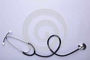Medical stethoscope on a grey background. Health care concept