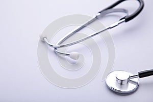 Medical stethoscope on a grey background. Health care concept