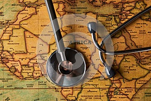 Medical stethoscope over africa healthcheck. close-up map