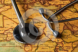 Medical stethoscope over africa healthcheck. close-up map