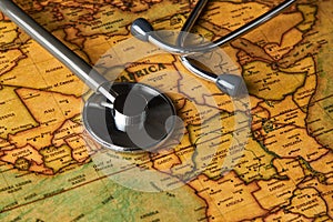 Medical stethoscope over africa healthcheck. close-up map