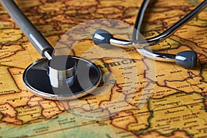 Medical stethoscope over africa healthcheck. close-up map