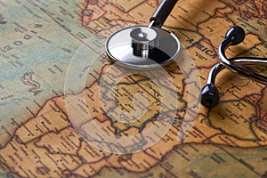 Medical stethoscope over Africa healthcheck. close-up map