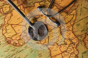 Medical stethoscope over africa healthcheck. close-up map