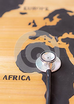 Medical stethoscope over africa healthcheck. Medical concept tourism travel care diseases healthy.Vertical image