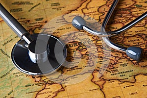 Medical stethoscope over Europe healthcheck. close-up map