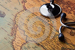 Medical stethoscope over North America healthcheck. close-up