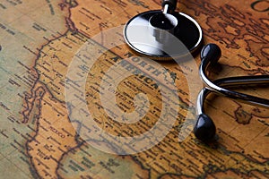 Medical stethoscope over North America healthcheck. close-up