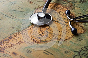 Medical stethoscope over South America healthcheck. close-up