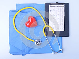 Medical stethoscope, patient medical history list, RX prescription, red heart and blue doctor uniform closeup. Medical