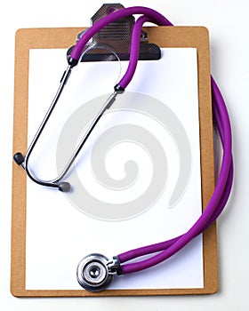 Medical stethoscope and a plate on the table