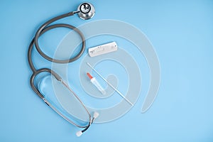 Medical stethoscope and Rapid antigen test Rapid Strep Test RST kit. Top view