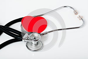 Medical stethoscope and a red heart