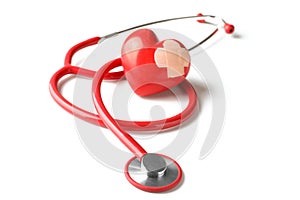 Medical stethoscope and red heart with plaster on white background. Cardiology concept