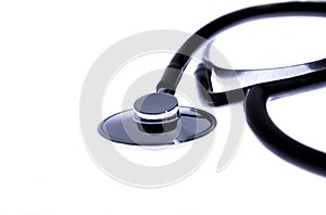 Medical stethoscope on white surface front perspective