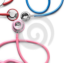 Medical stethoscopes on white background