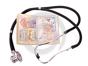 Medical still life with stethoscope and passport.