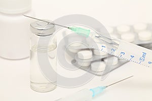 Medical still-life with syringes and tablets