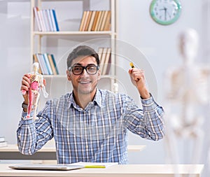 Medical student studying in classroom