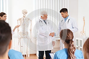 Medical students having lecture in orthopedics