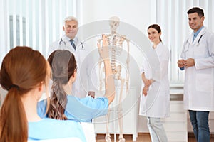 Medical students having lecture in orthopedics