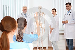 Medical students having lecture in orthopedics photo