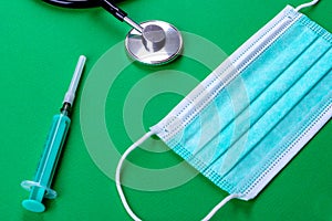 Medical supplies on a colored background as an attribute of the fight against coronavirus