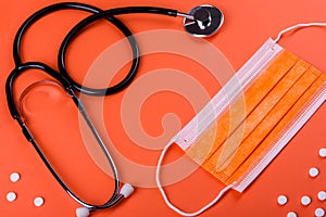 Medical supplies on a colored background as an attribute of the fight against coronavirus