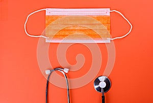 Medical supplies on a colored background as an attribute of the fight against coronavirus