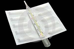 Medical suppository and thermometer photo